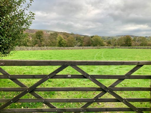 Looking across the adjacent grassed secondary vehicle parking field
